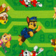 Baumwolljersey Paw Patrol - springende Hunde auf grün